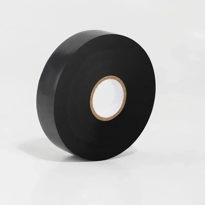 Roll of black tape on a white background
