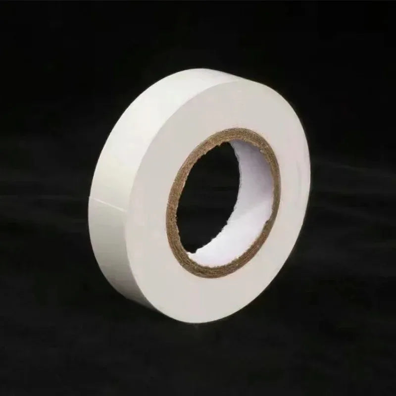 Roll of white tape on a black background