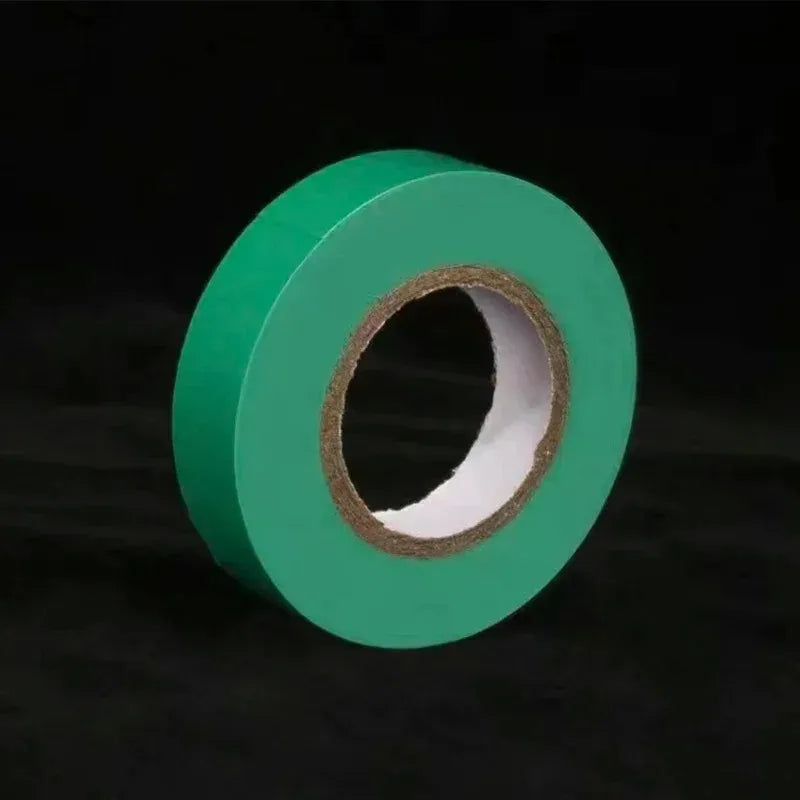 Green roll of tape on a black background