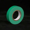 Green roll of tape on a black background