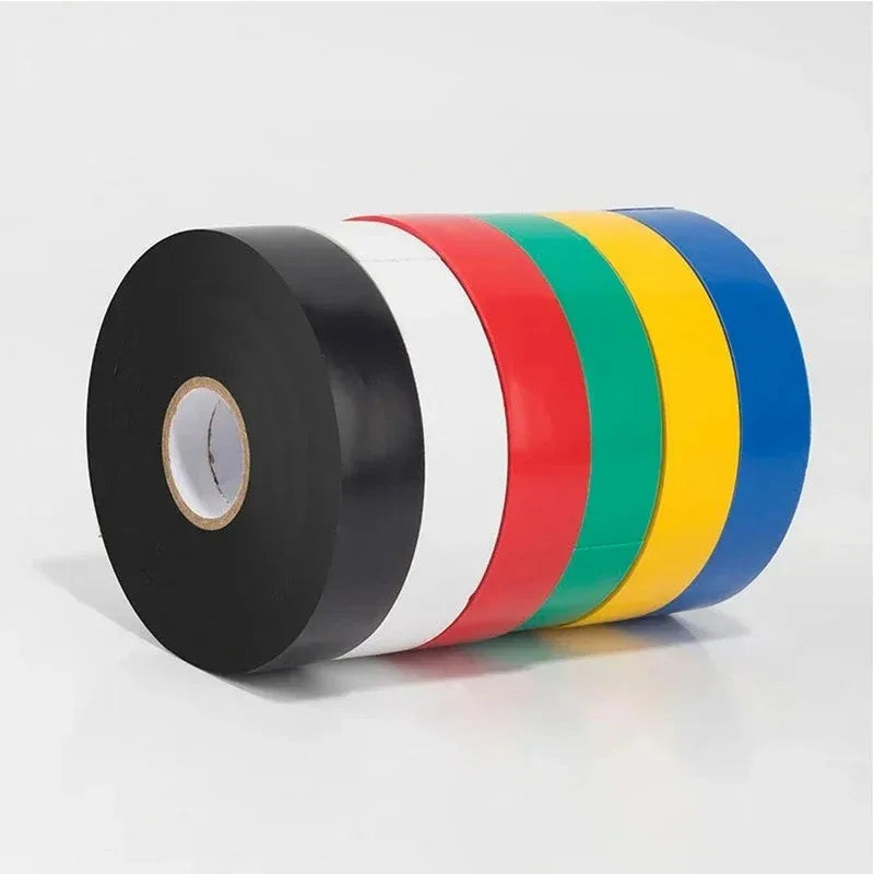 Set of rolls of black and multicolored tape on a white background